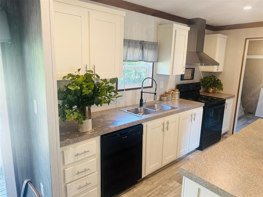 843 Southwest Central Terrace Fort White, FL 32038 - Photo 13 of 30 a kitchen with sink and cabinets