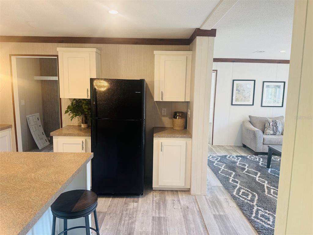 843 Southwest Central Terrace Fort White, FL 32038 - Photo 14 of 30 a kitchen with a refrigerator and a stove