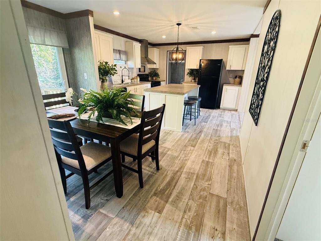 843 Southwest Central Terrace Fort White, FL 32038 - Photo 15 of 30 a view of a dining room with furniture and a chandelier