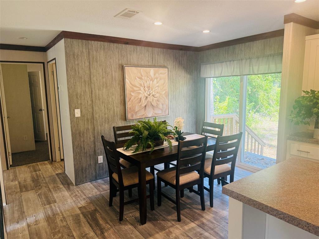 843 Southwest Central Terrace Fort White, FL 32038 - Photo 18 of 30 a view of a dining room with furniture and a window