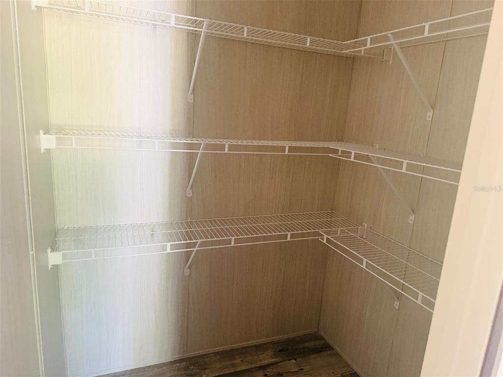 843 Southwest Central Terrace Fort White, FL 32038 - Photo 19 of 30 a view of a room with racks on the wall