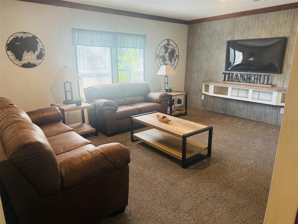 843 Southwest Central Terrace Fort White, FL 32038 - Photo 21 of 30 a living room with furniture and a window