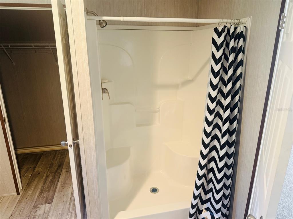 843 Southwest Central Terrace Fort White, FL 32038 - Photo 26 of 30 a bathroom with a shower and a curtain