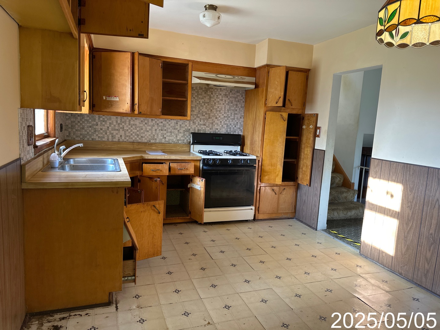 9276 North Western Avenue Des Plaines, IL 60016 - Photo 7 of 18 a kitchen with a sink appliances and cabinets