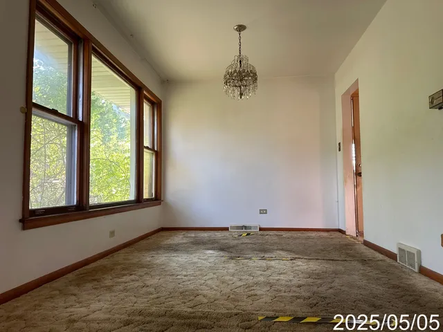 en empty room with an empty space and wooden floor