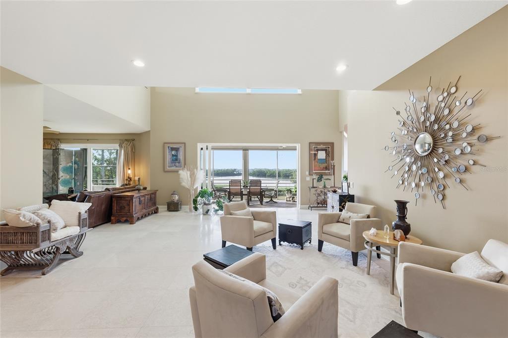 6511 Bayshore Road Palmetto, FL 34221 - Photo 11 of 53 a living room with furniture and a large window