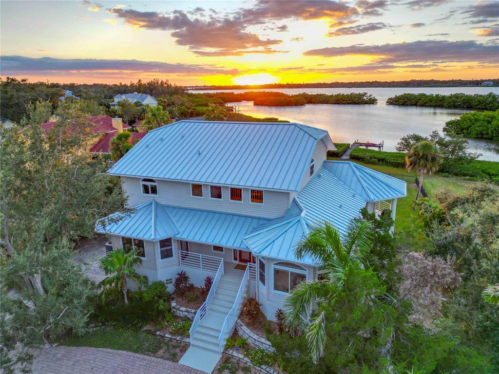 6511 Bayshore Road Palmetto, FL 34221 - Photo 2 of 53 an aerial view of a house with a yard and lake view