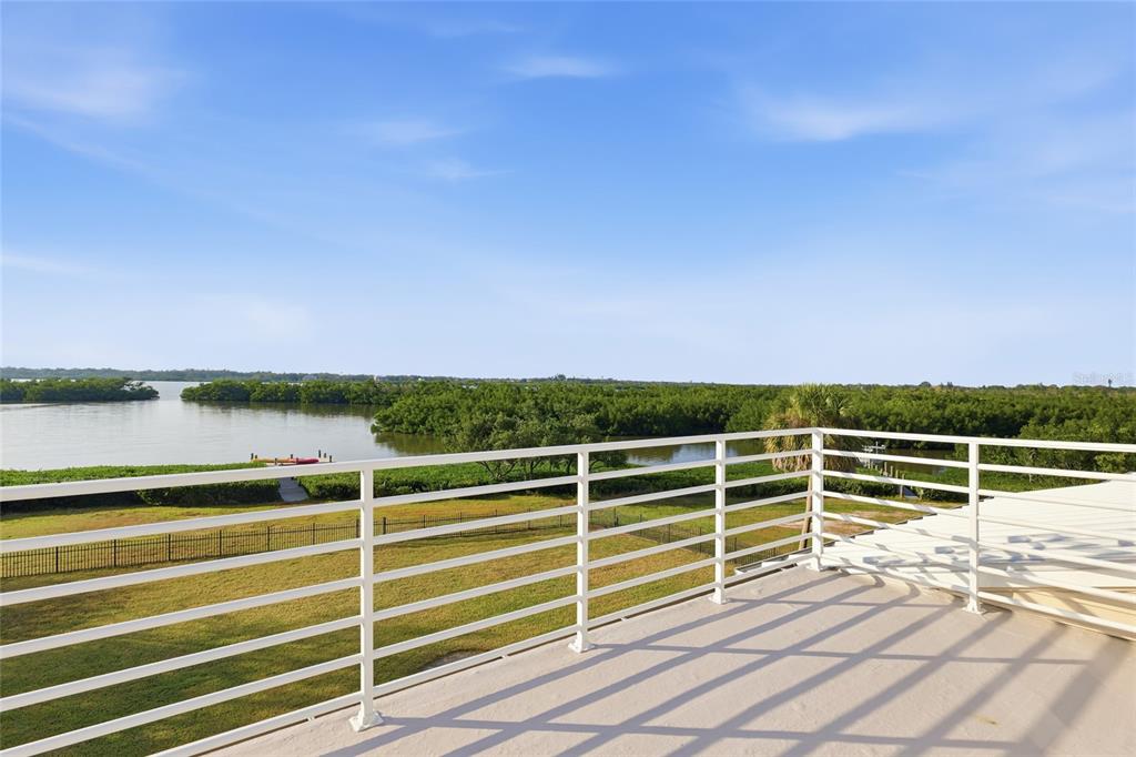 6511 Bayshore Road Palmetto, FL 34221 - Photo 31 of 53 a view of a balcony with floor to ceiling windows