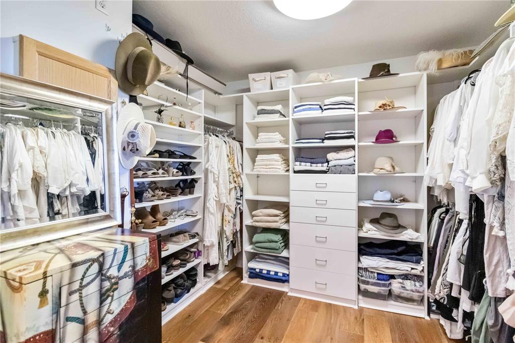 6511 Bayshore Road Palmetto, FL 34221 - Photo 35 of 53 a view of walk in closet with clothes and shoes