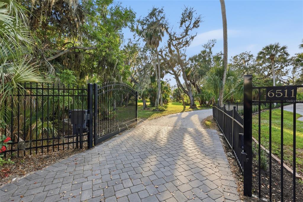 6511 Bayshore Road Palmetto, FL 34221 - Photo 4 of 53 a view of street with wooden fence