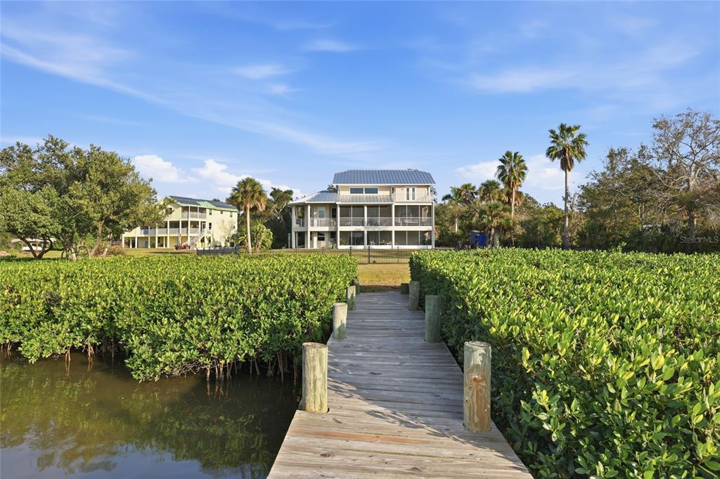 6511 Bayshore Road Palmetto, FL 34221 - Photo 42 of 53 a view of a house with a yard