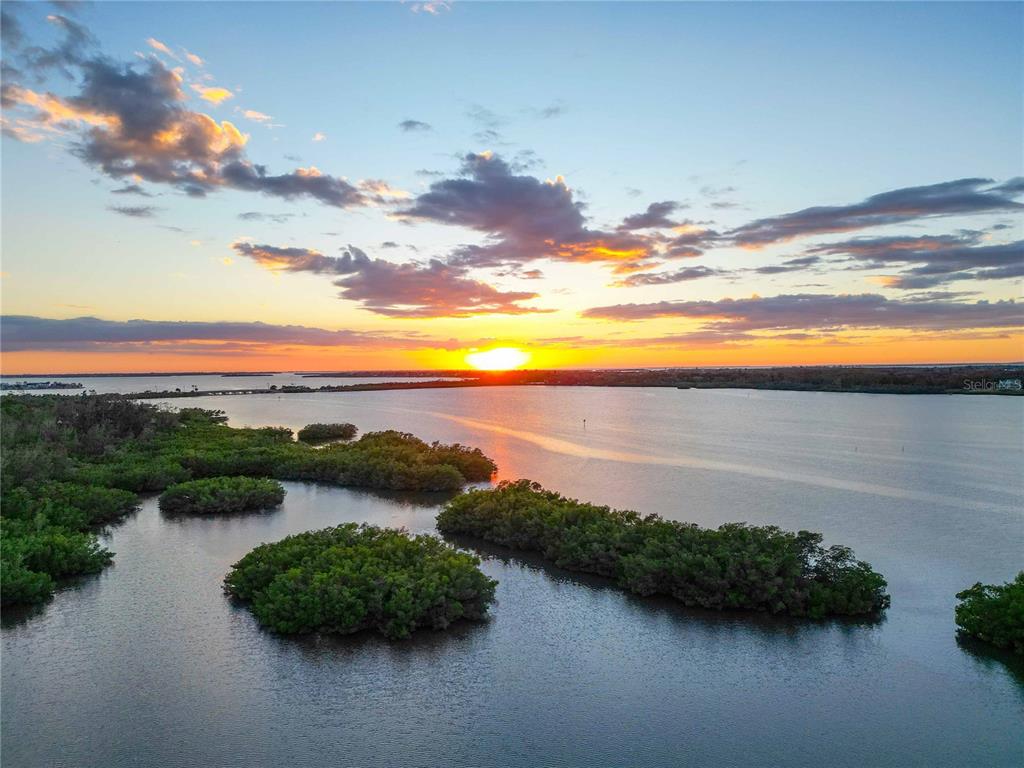 6511 Bayshore Road Palmetto, FL 34221 - Photo 46 of 53 a view of a lake with a mountain in the background