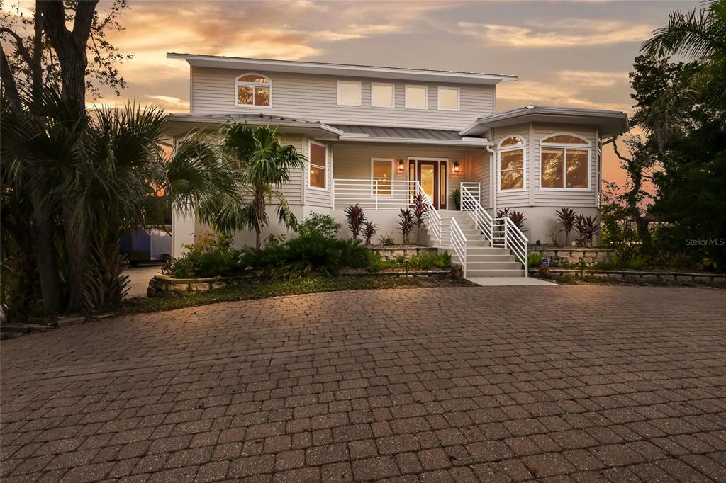 6511 Bayshore Road Palmetto, FL 34221 - Photo 49 of 53 a front view of house with yard and trees around