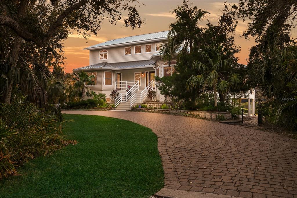 6511 Bayshore Road Palmetto, FL 34221 - Photo 50 of 53 a front view of a house with a yard