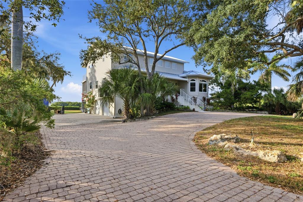 6511 Bayshore Road Palmetto, FL 34221 - Photo 6 of 53 a view of a house with a yard