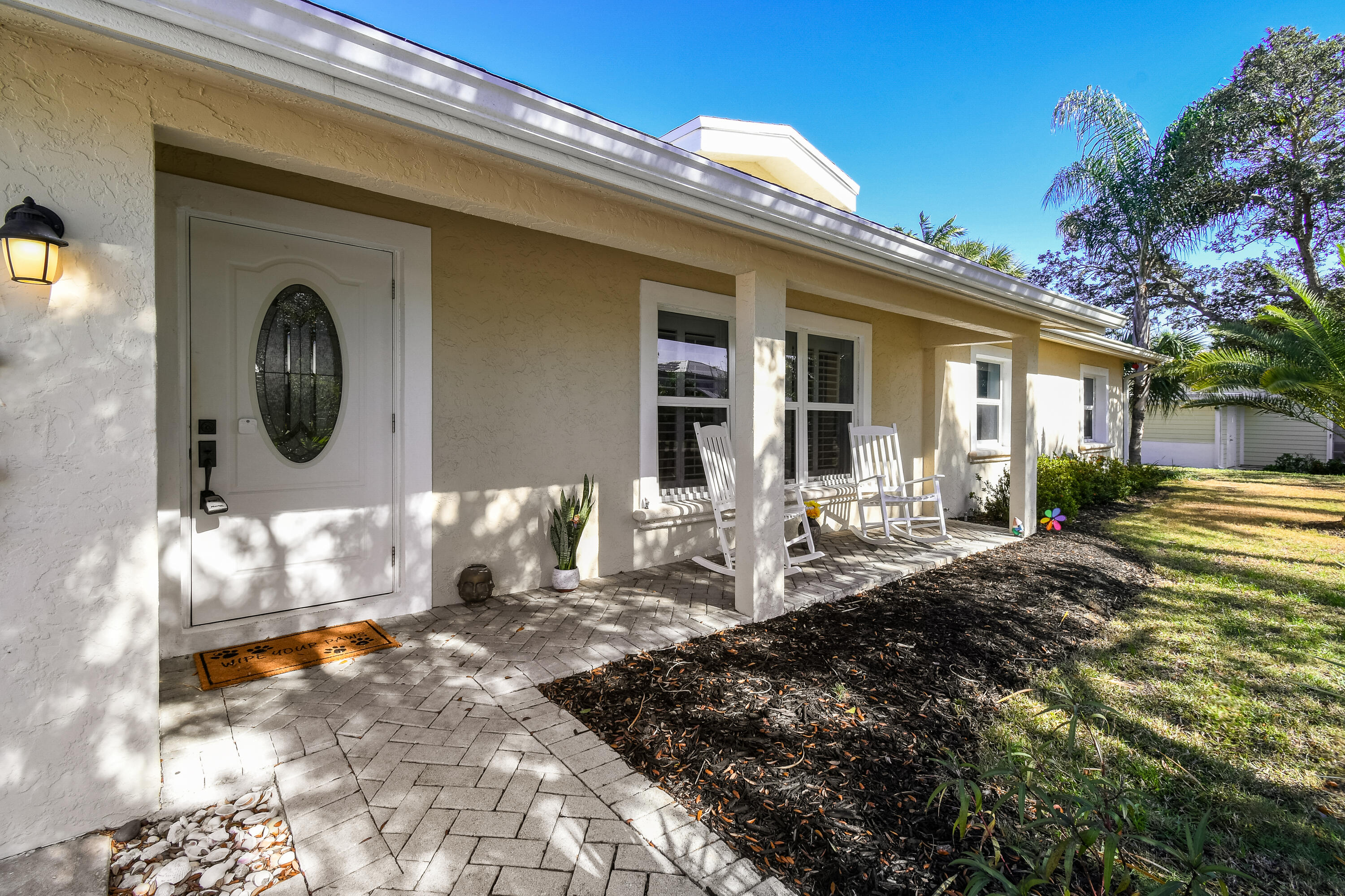 8963 Southeast Ceres Street Hobe Sound, FL 33455 - Photo 1 of 53 Front exterior entrance
