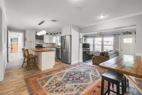 a kitchen with stainless steel appliances granite countertop a sink stove and microwave