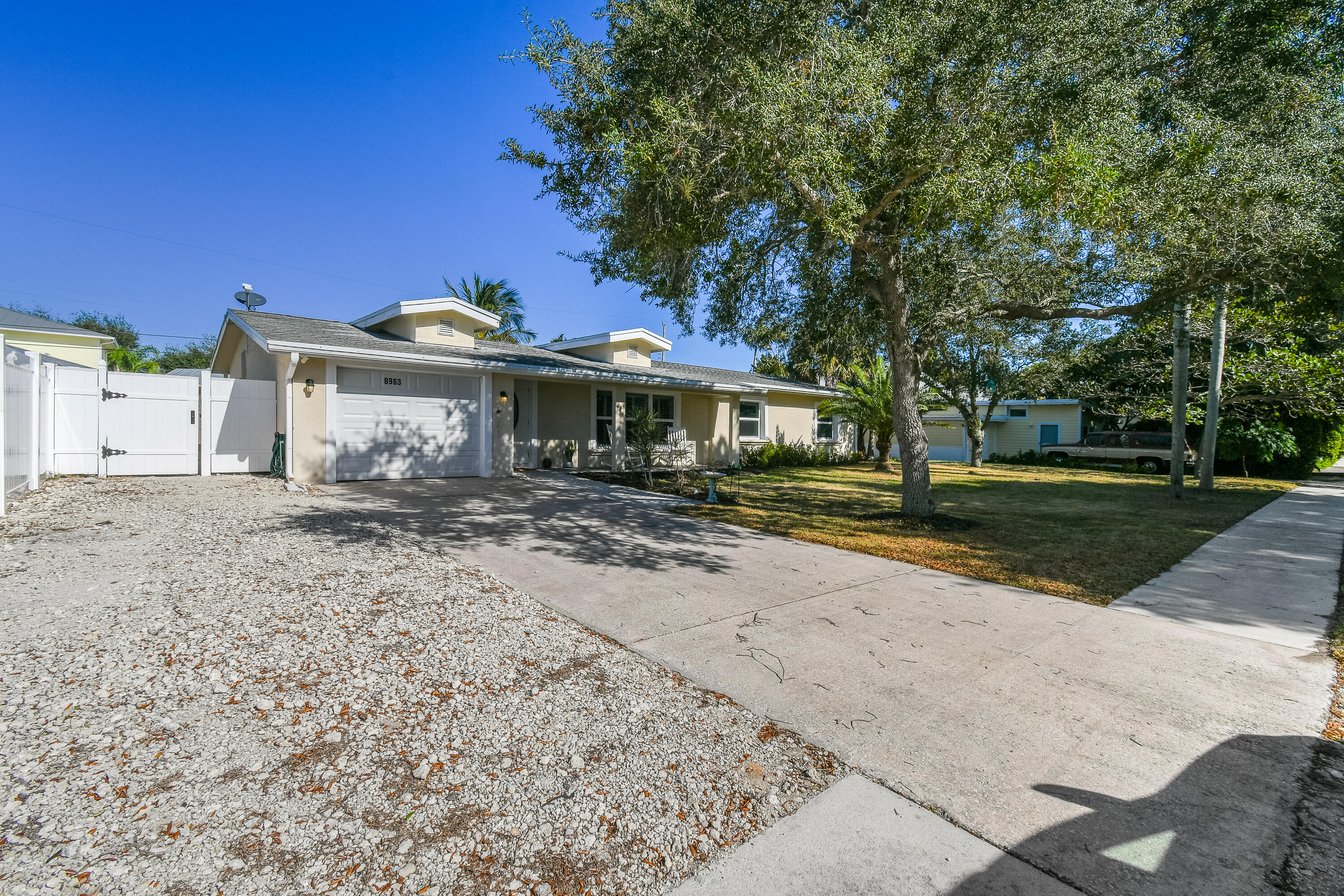 8963 Southeast Ceres Street Hobe Sound, FL 33455 - Photo 3 of 53 Home view from street