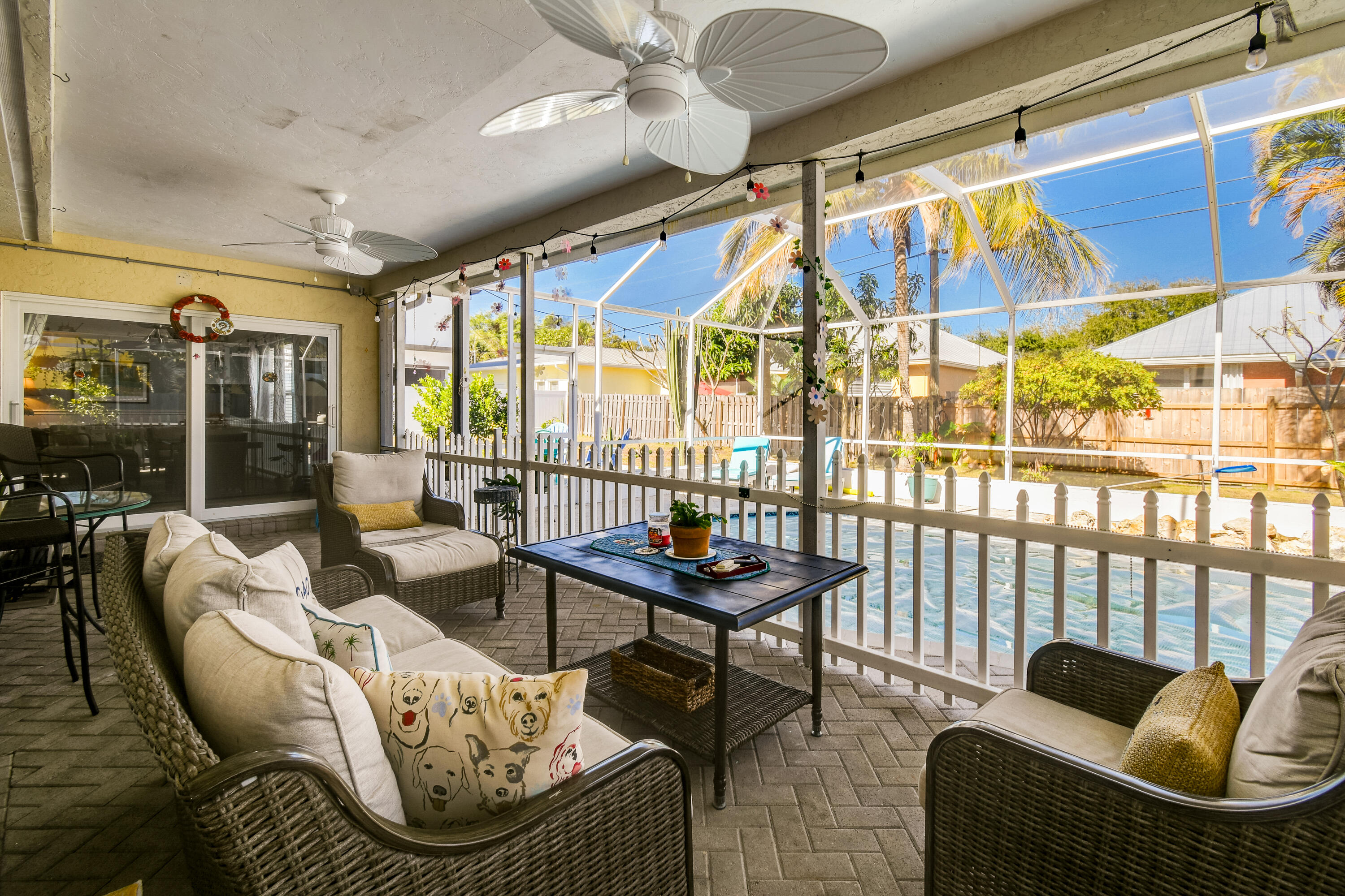 8963 Southeast Ceres Street Hobe Sound, FL 33455 - Photo 40 of 53 Outdoor seating and pool2