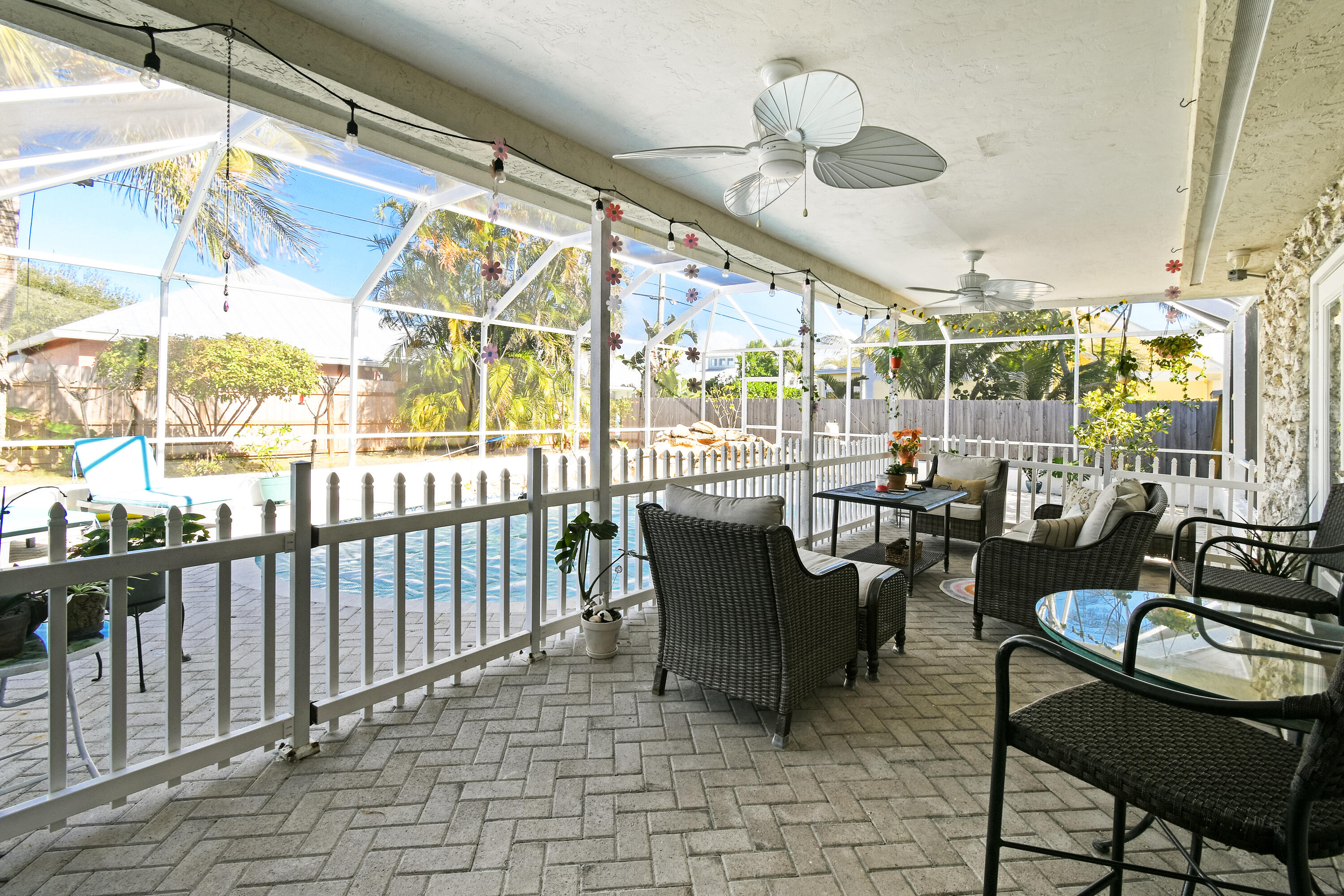 8963 Southeast Ceres Street Hobe Sound, FL 33455 - Photo 41 of 53 Outdoor seating and pool