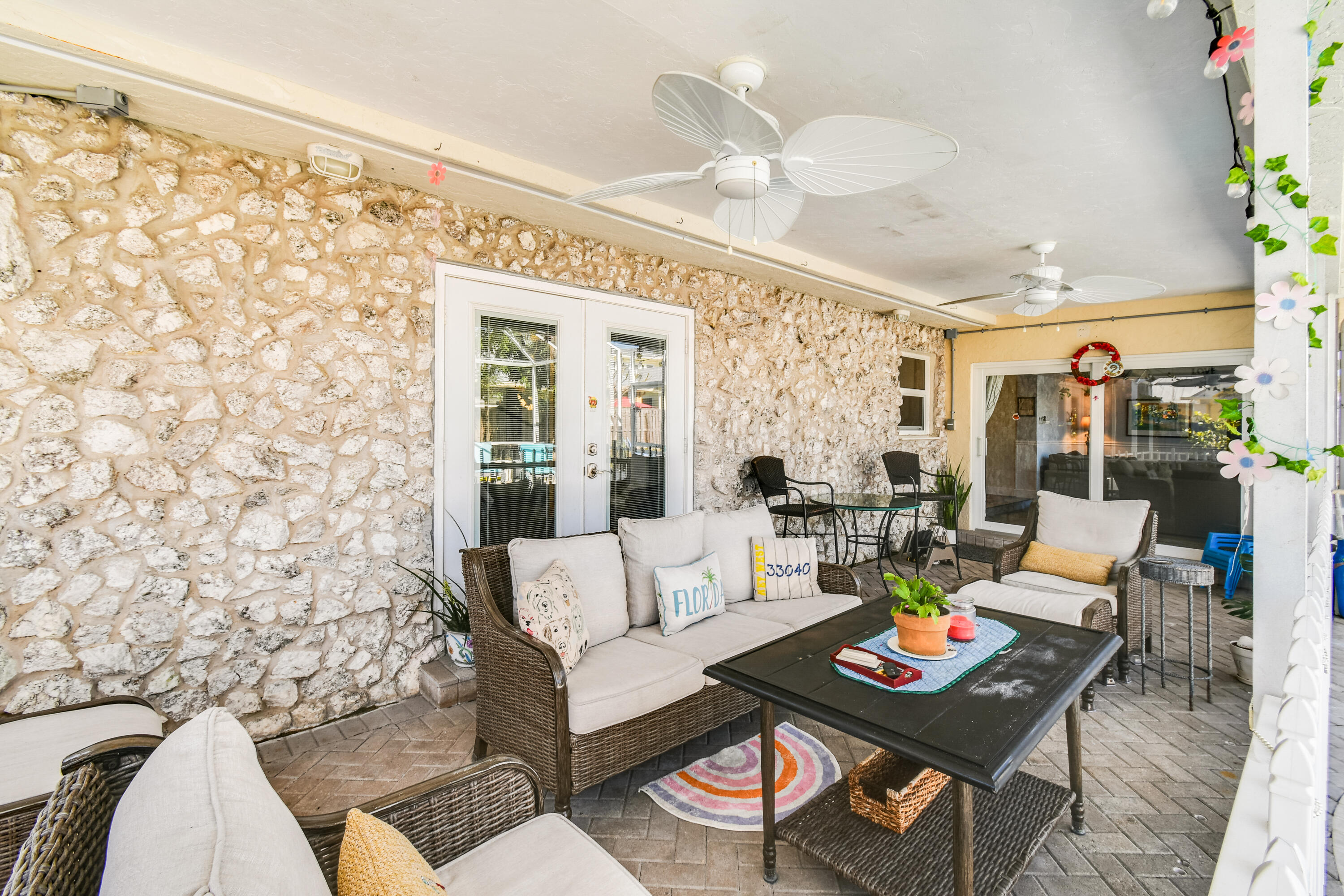 8963 Southeast Ceres Street Hobe Sound, FL 33455 - Photo 42 of 53 Outdoor porch gathering area