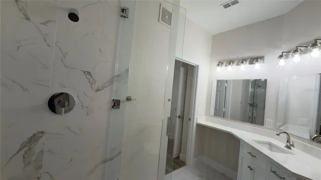 a kitchen with a refrigerator stove and microwave