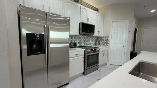 an aerial view of a house with a yard and garden
