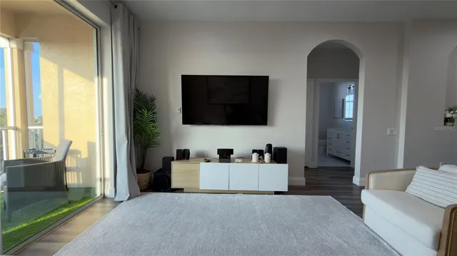 a living room with lots of furniture and gym equipment