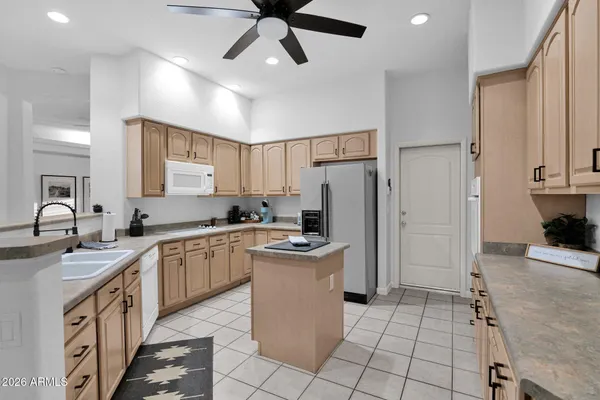 a kitchen with a sink stove and refrigerator