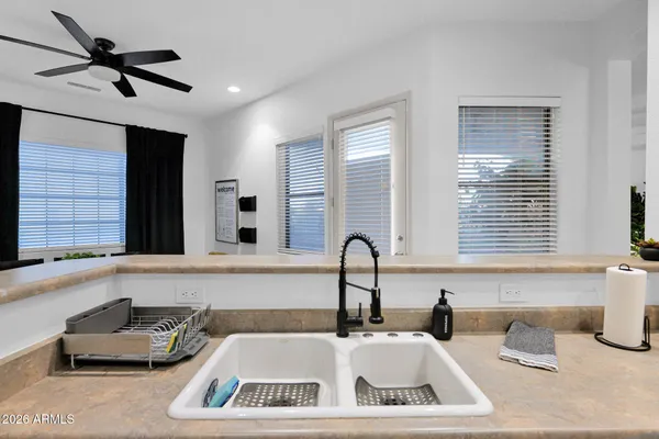 a kitchen with a sink and a stove