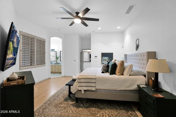 a bedroom with a bed window and a couch