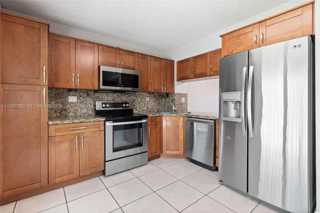 a view of kitchen with furniture wooden floor and window
