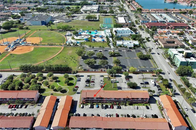 an aerial view of residential houses and outdoor space