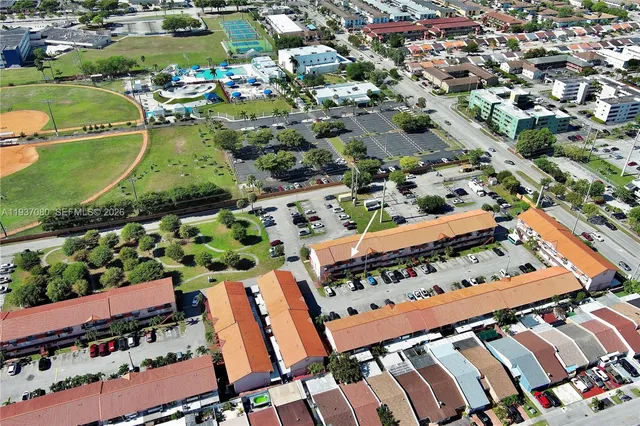 an aerial view of residential houses with outdoor space
