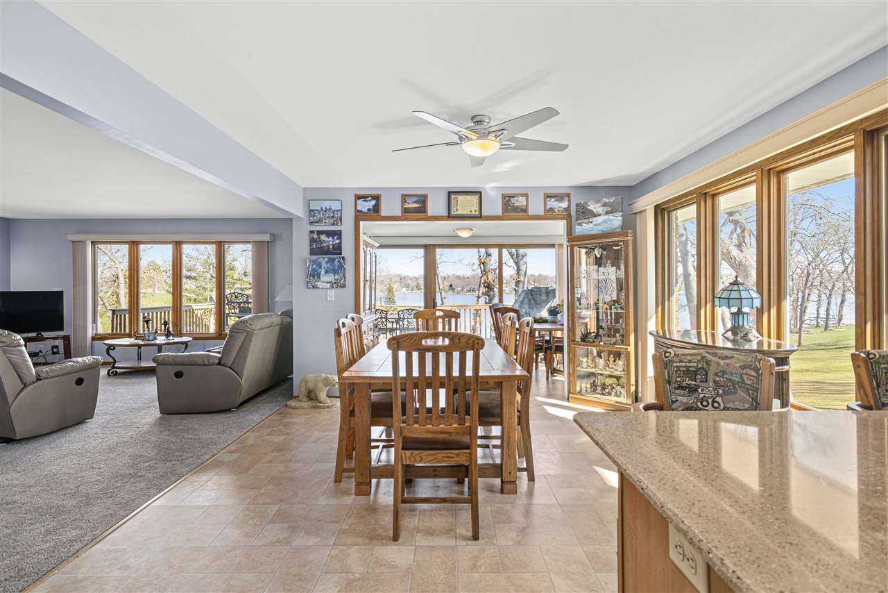 1947 Baintree Road Lake Summerset, IL 61019 - Photo 11 of 53 a living room with furniture a flat screen tv and a large window