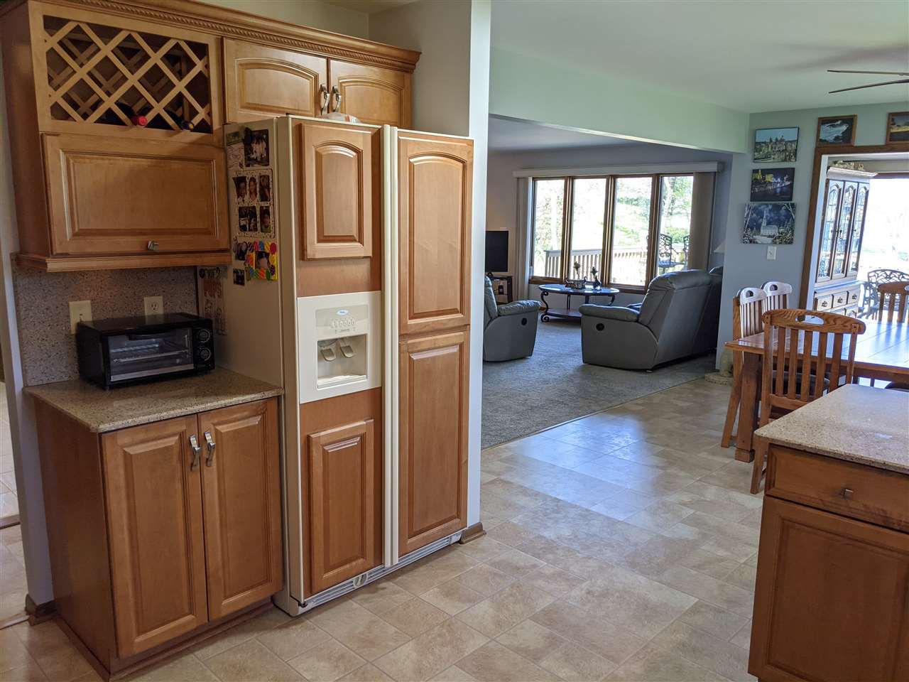 1947 Baintree Road Lake Summerset, IL 61019 - Photo 12 of 53 a kitchen with stainless steel appliances granite countertop a refrigerator a stove and a wooden cabinets