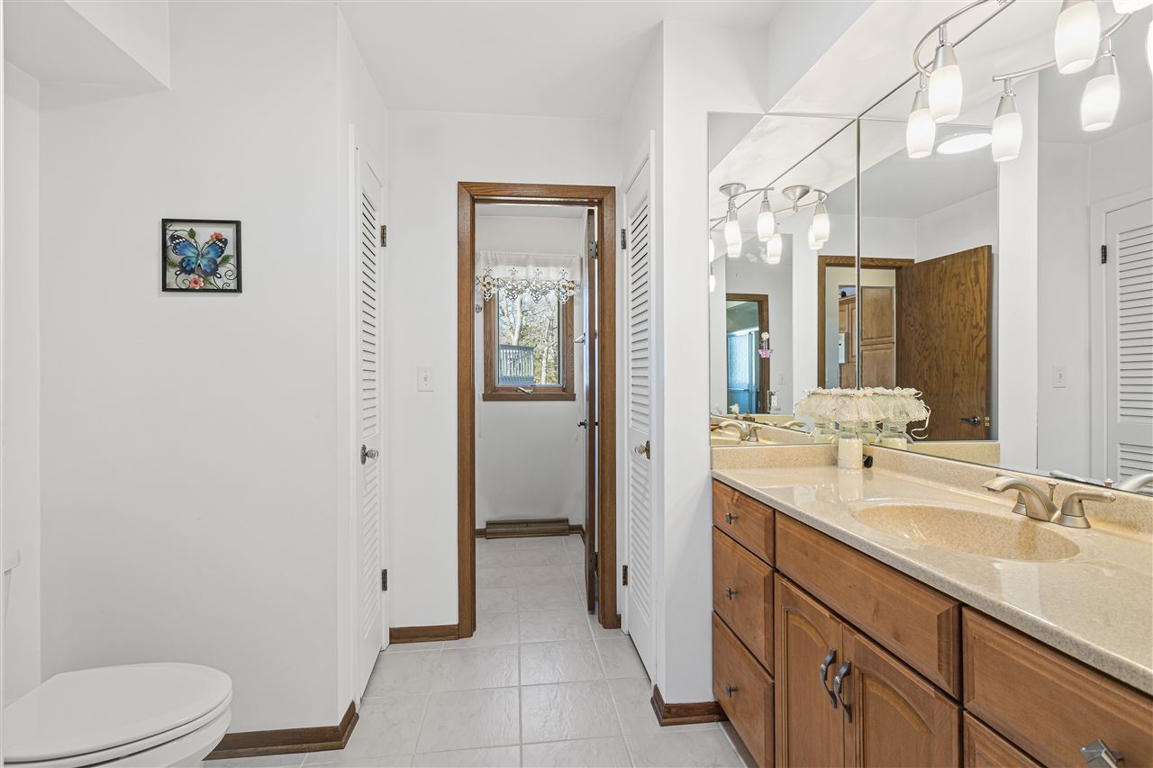 1947 Baintree Road Lake Summerset, IL 61019 - Photo 14 of 53 a bathroom with a sink a toilet and shower