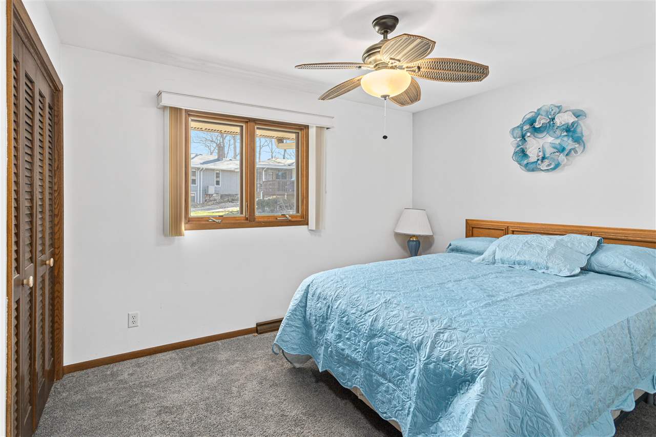 1947 Baintree Road Lake Summerset, IL 61019 - Photo 15 of 53 a bedroom with a bed and a chandelier