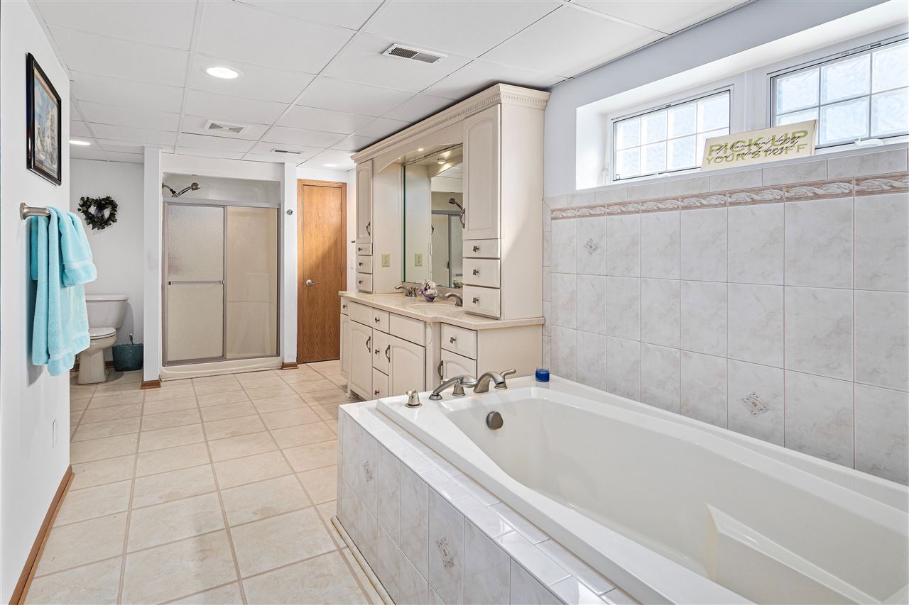 1947 Baintree Road Lake Summerset, IL 61019 - Photo 23 of 53 a bathroom with a bathtub and a shower