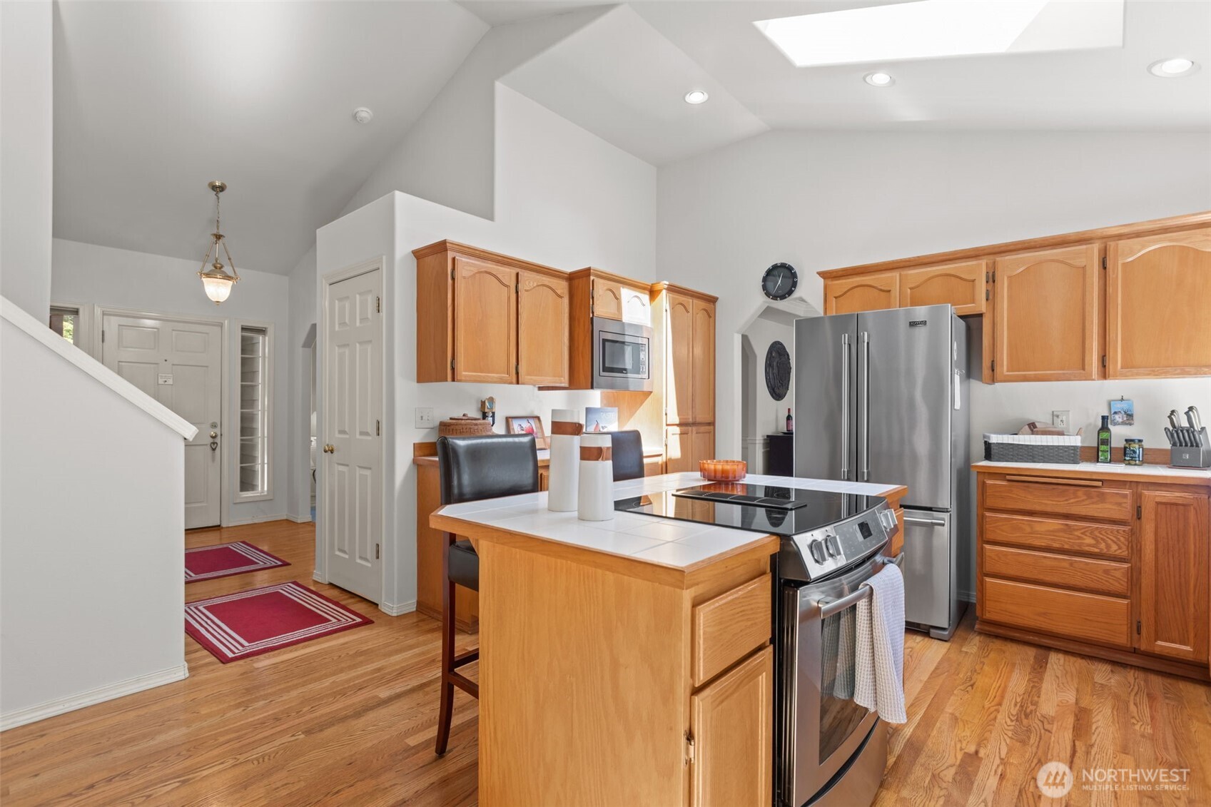 2414 Kennewick Place Northeast Renton, WA 98056 - Photo 12 of 40 a kitchen that has a sink cabinets and wooden floor