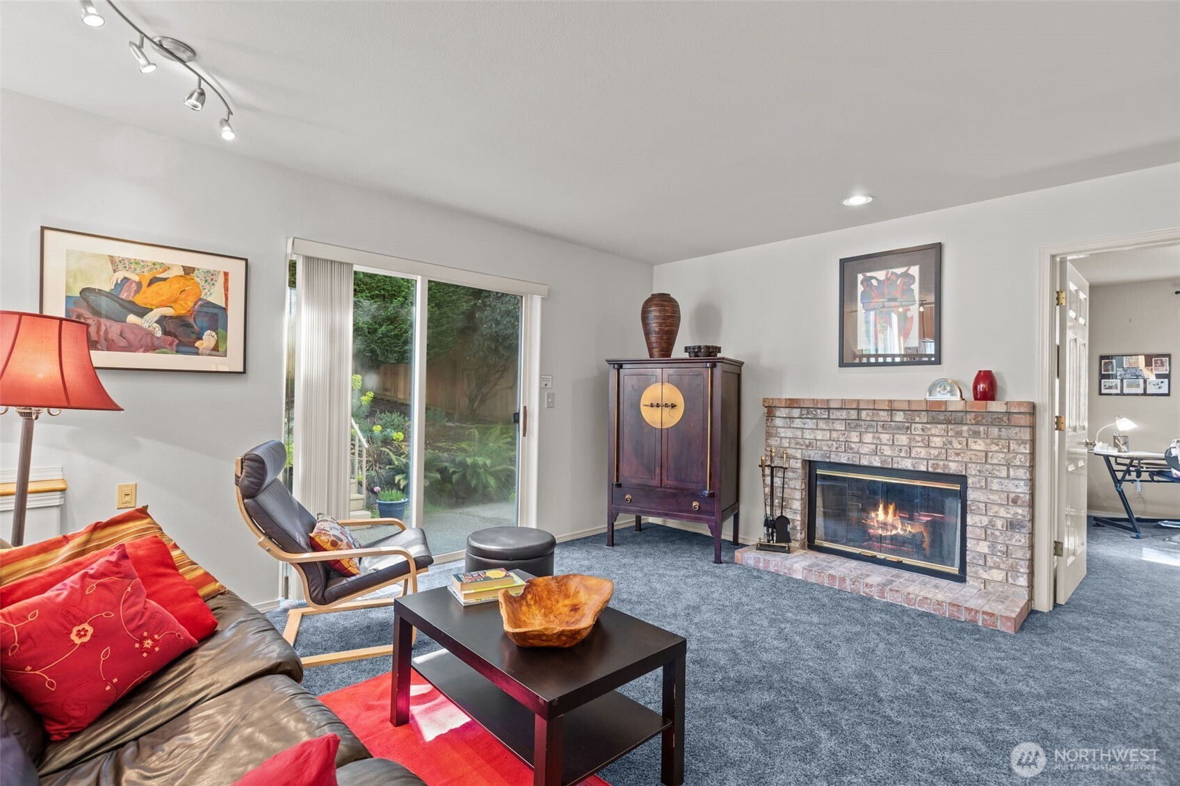 2414 Kennewick Place Northeast Renton, WA 98056 - Photo 14 of 40 a living room with furniture and a fireplace