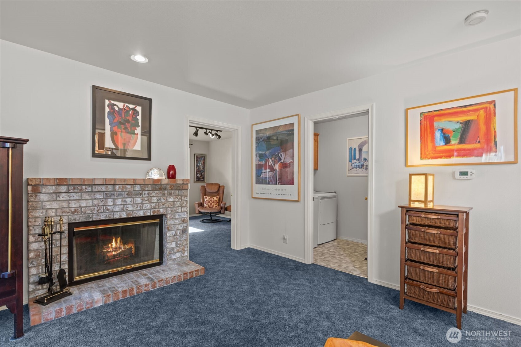 2414 Kennewick Place Northeast Renton, WA 98056 - Photo 15 of 40 a living room with furniture a fireplace and a window