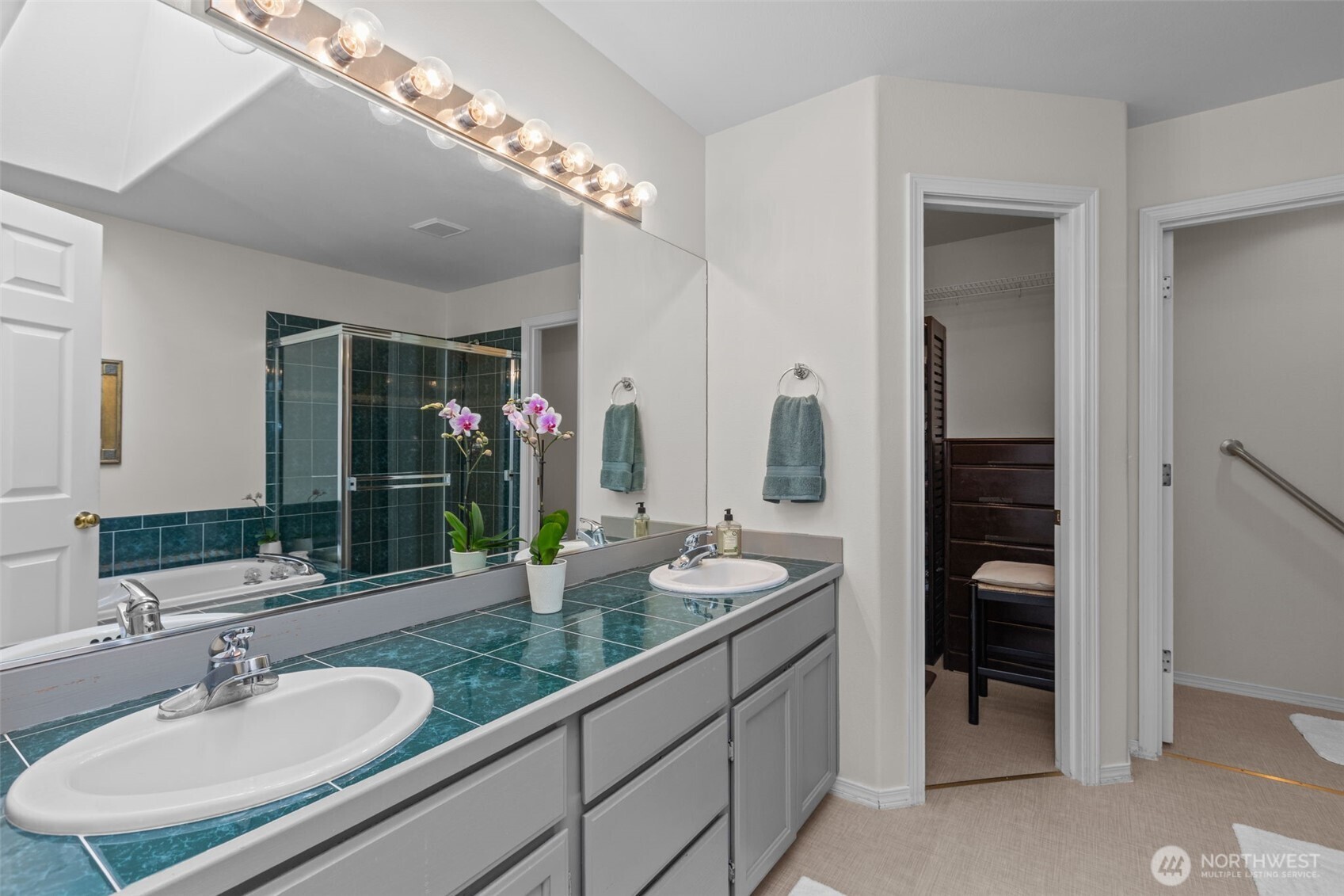 2414 Kennewick Place Northeast Renton, WA 98056 - Photo 21 of 40 a bathroom with a double vanity sink and a mirror