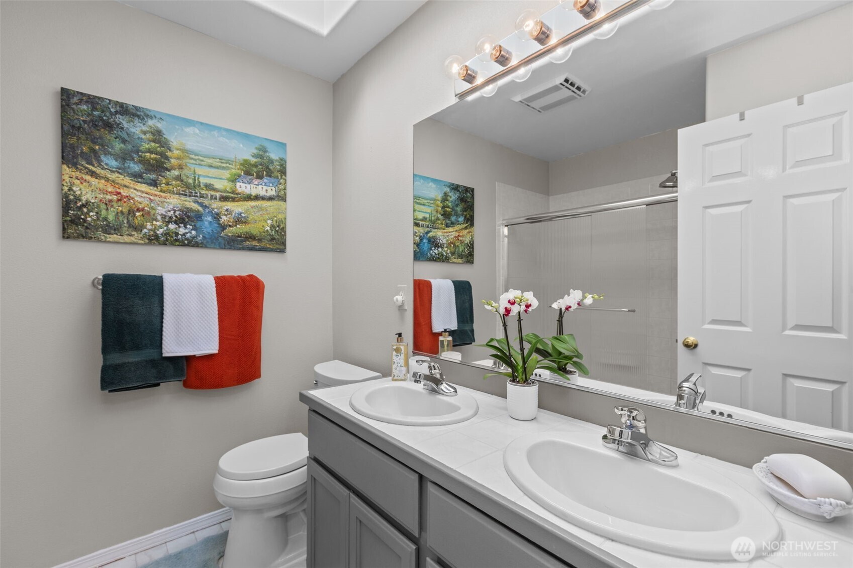 2414 Kennewick Place Northeast Renton, WA 98056 - Photo 25 of 40 a bathroom with a sink mirror and toilet