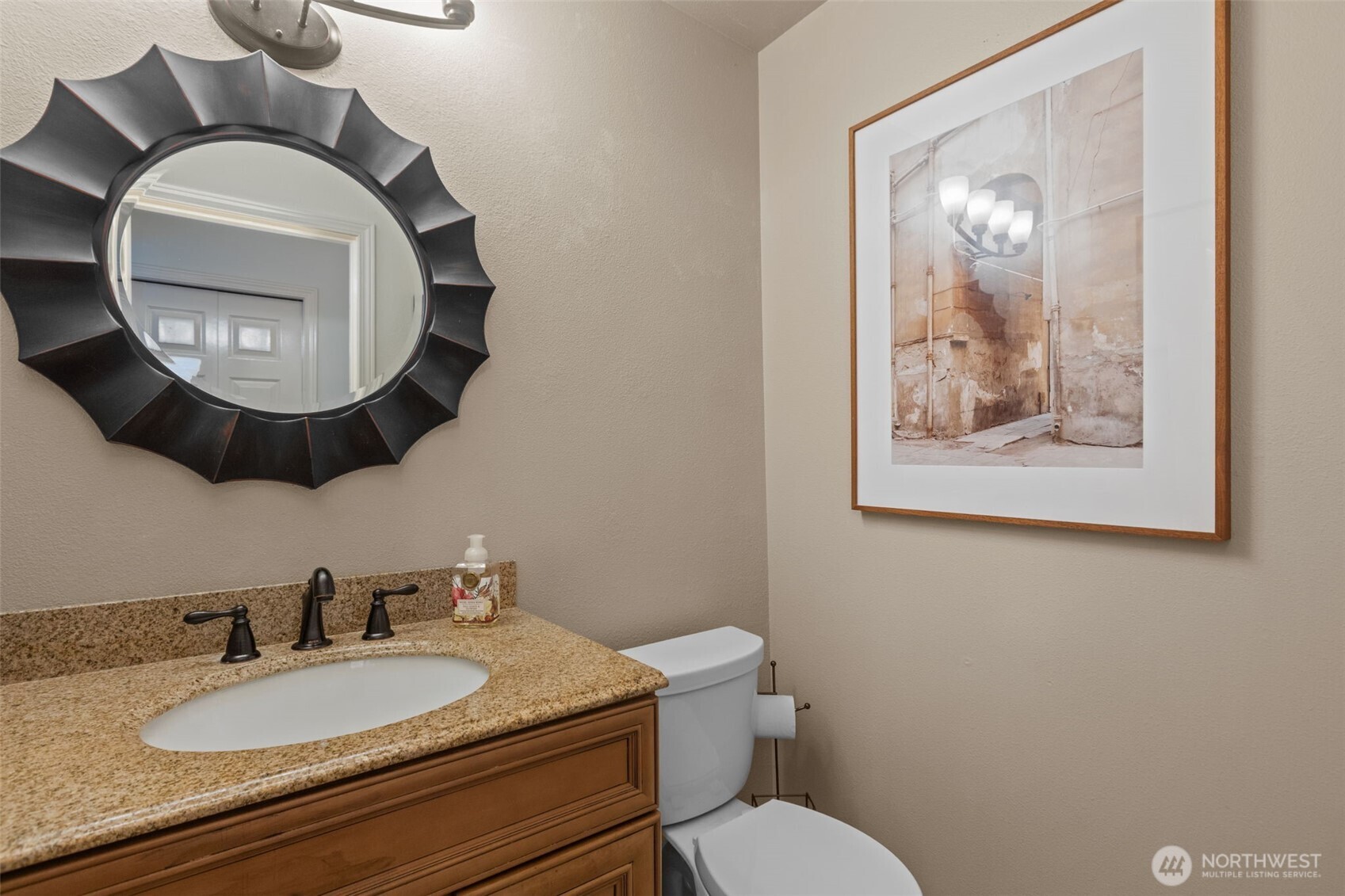 2414 Kennewick Place Northeast Renton, WA 98056 - Photo 28 of 40 a bathroom with a toilet a sink and mirror
