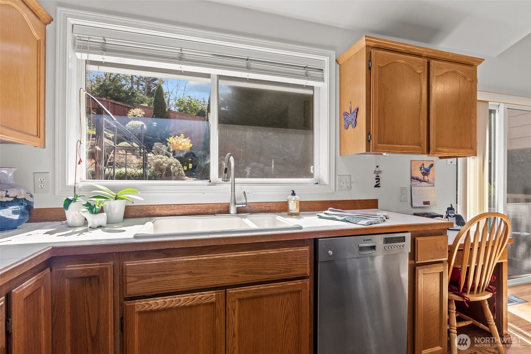 2414 Kennewick Place Northeast Renton, WA 98056 - Photo 9 of 40 a kitchen with a sink a window and a refrigerator