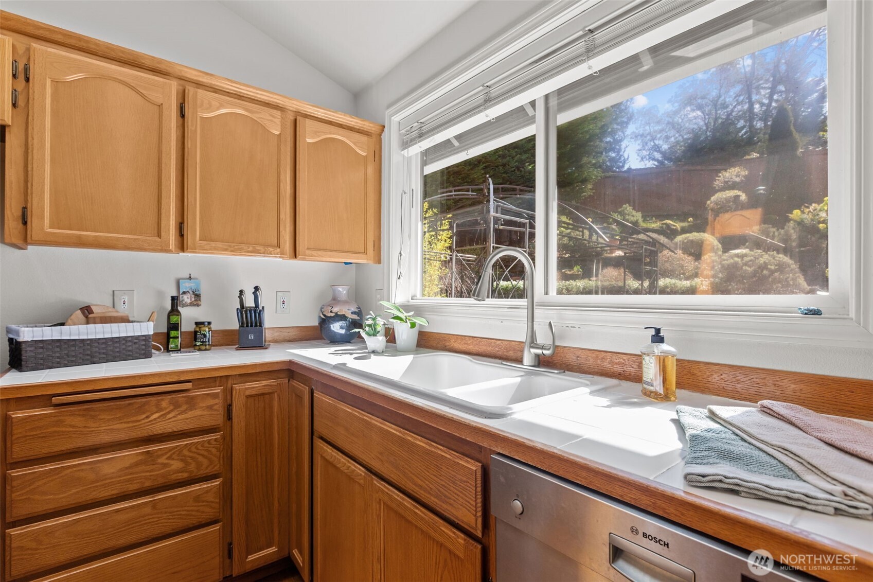 2414 Kennewick Place Northeast Renton, WA 98056 - Photo 10 of 40 a kitchen with a sink and a window