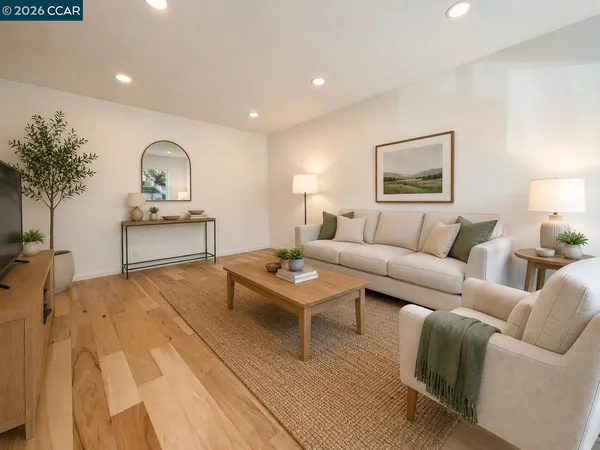 a living room with furniture and a table