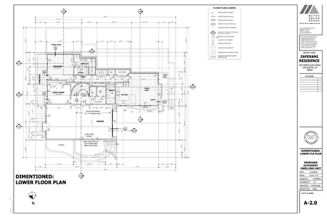 a view of a yard with plants and large trees