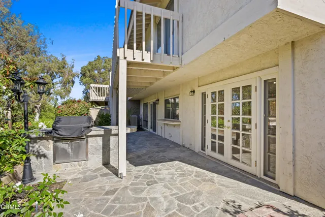 a view of a building with a sitting area